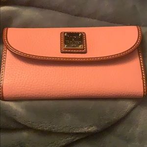 Pale pink continental clutch Dooney and Bourke